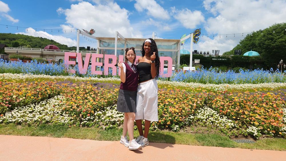 Students at the entrance gardens of Everland
